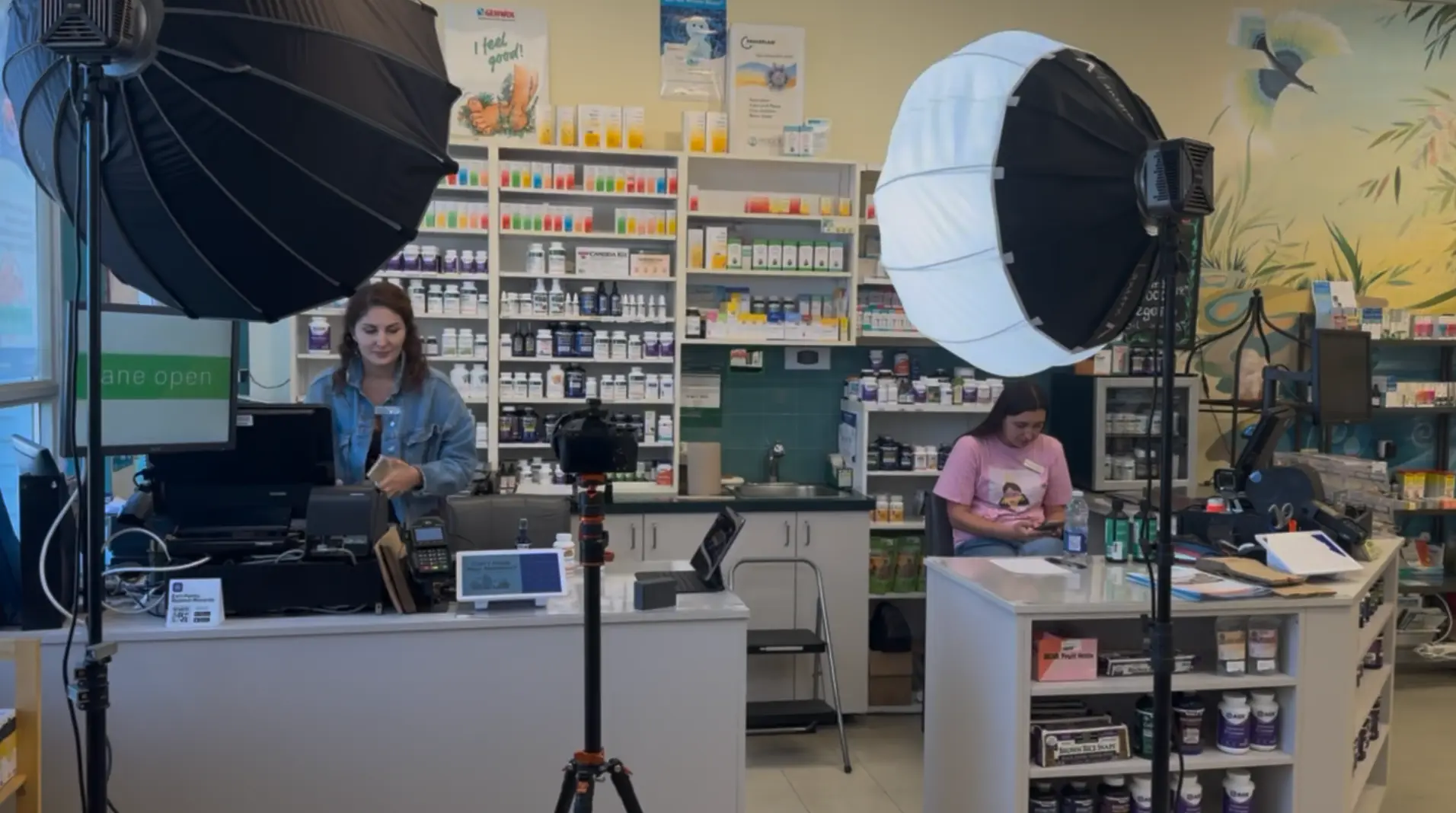 Behind-the-scenes filming setup for "The Choice of 7 Billion" in a North American pharmacy
